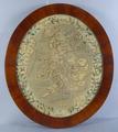 18. Early 19th century oval embroidered map